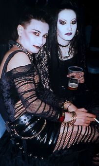 Goth couple with purple lips..